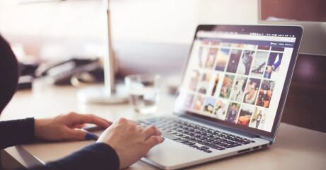 a person is browsing videos on his laptop